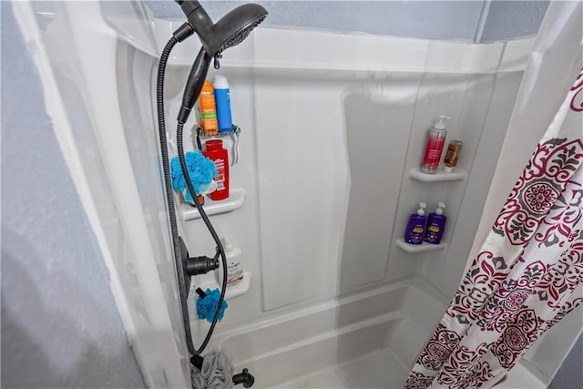 bathroom with a shower with shower curtain