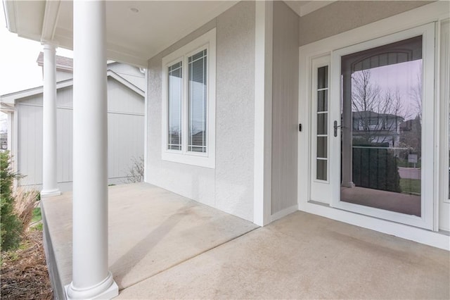 17281 S Kimble St, Olathe, KS 66062 - entrance to property featuring stucco siding and covered porch