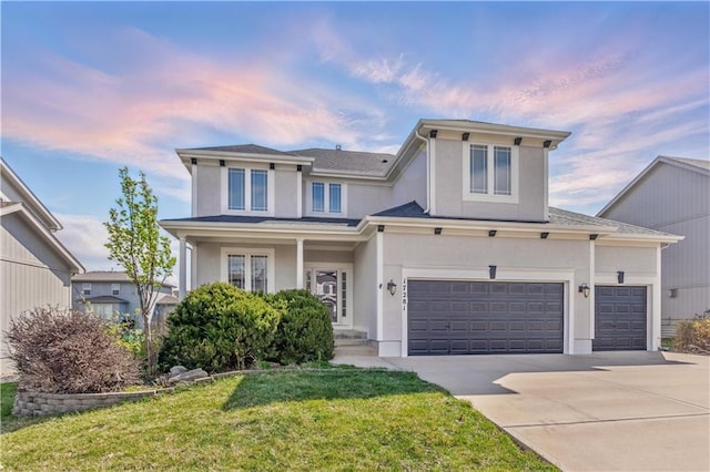 17281 S Kimble St, Olathe, KS 66062 - traditional home with concrete driveway, stucco siding, a yard, and an attached garage