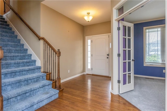 17281 S Kimble St, Olathe, KS 66062 - entryway with stairway and wood finished floors