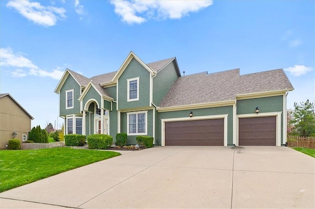 view of front of home featuring an attached garage, a front lawn, stucco siding, and concrete driveway