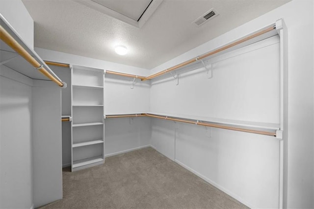 walk in closet with carpet flooring and visible vents