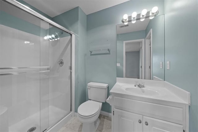 full bath featuring visible vents, vanity, toilet, baseboards, and a stall shower