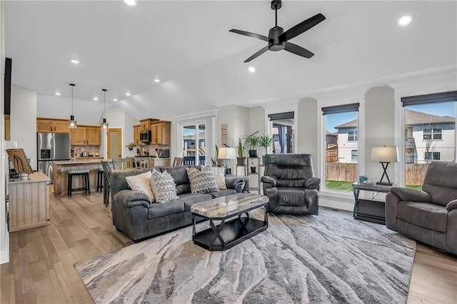 900 NW Lindenwood Dr, Grain Valley, MO 64029 - living area with ceiling fan, lofted ceiling, light wood-style flooring, and recessed lighting