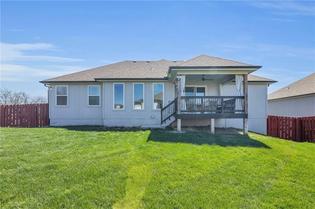 900 NW Lindenwood Dr, Grain Valley, MO 64029 - back of house with a ceiling fan and a shingled roof