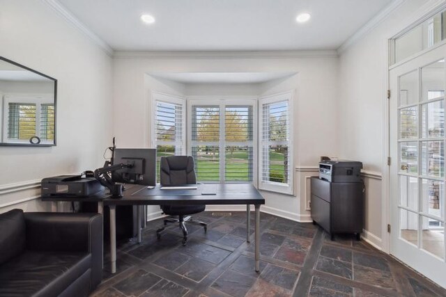home office featuring crown molding, a healthy amount of sunlight, and stone tile flooring
