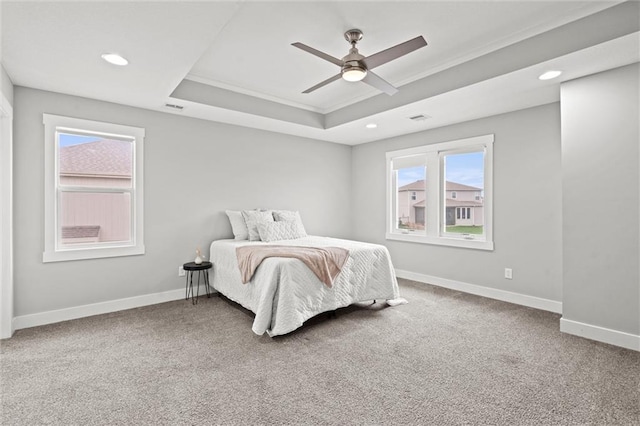 7295 NW Forest Lakes Dr, Parkville, MO 64152 - bedroom with a tray ceiling, multiple windows, recessed lighting, carpet floors, and a ceiling fan