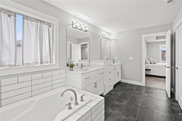 7295 NW Forest Lakes Dr, Parkville, MO 64152 - ensuite bathroom featuring vanity, a garden tub, and tile patterned flooring