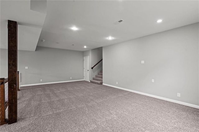 7295 NW Forest Lakes Dr, Parkville, MO 64152 - spare room with carpet flooring, stairway, and recessed lighting