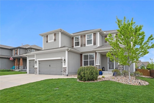 prairie-style house featuring an attached garage, fence, driveway, and a front yard
