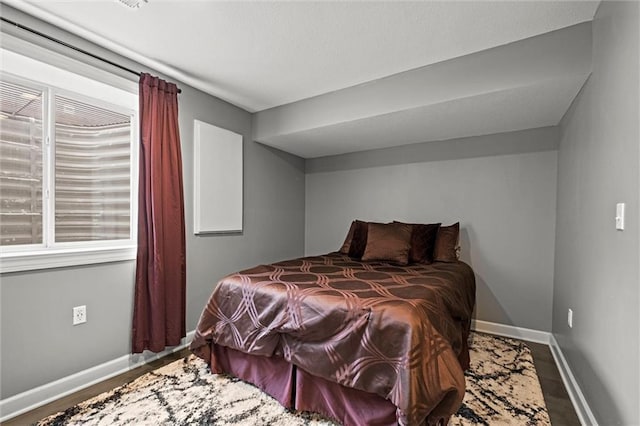 bedroom featuring baseboards