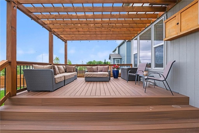 wooden deck featuring a pergola and outdoor lounge area