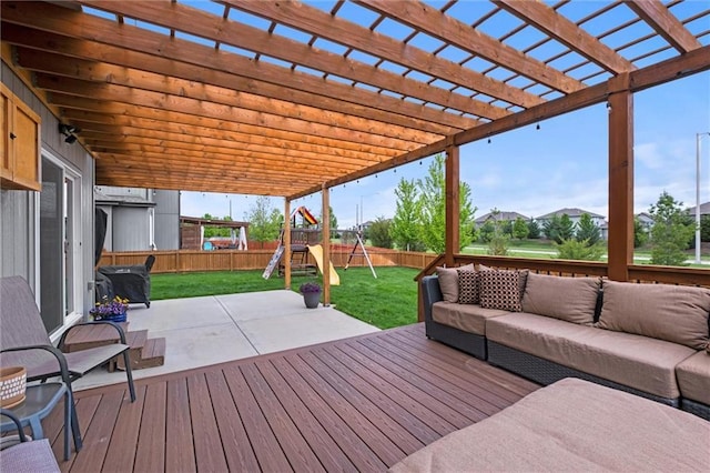 deck with a fenced backyard, a playground, a yard, and an outdoor hangout area