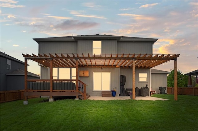 rear view of house with a yard, a pergola, and entry steps