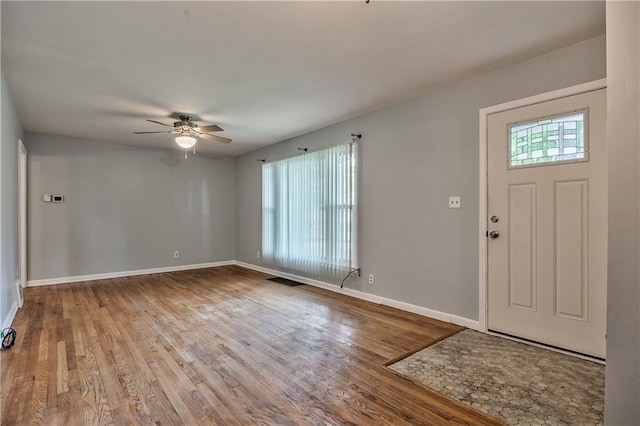 10408 E 28th Ter S, Independence, MO 64052 - foyer featuring a ceiling fan, baseboards, and wood finished floors