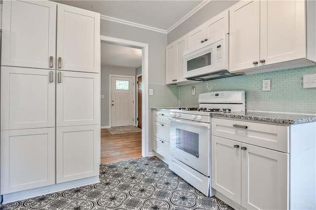 10408 E 28th Ter S, Independence, MO 64052 - kitchen featuring white appliances, ornamental molding, white cabinets, light stone counters, and backsplash