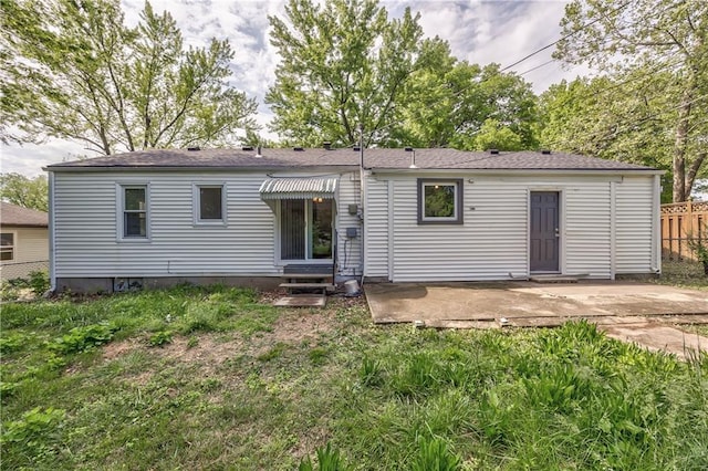 10408 E 28th Ter S, Independence, MO 64052 - back of property featuring entry steps, fence, and a patio area