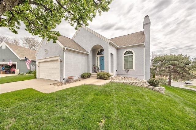 12207 England St, Overland Park, KS 66213 - view of front facade featuring an attached garage, a chimney, concrete driveway, stucco siding, and a front lawn