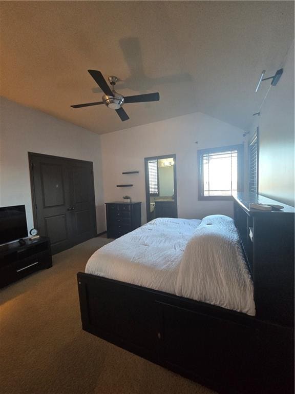 carpeted bedroom with lofted ceiling and ceiling fan
