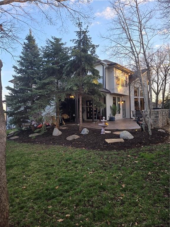 view of yard featuring a balcony and a patio area