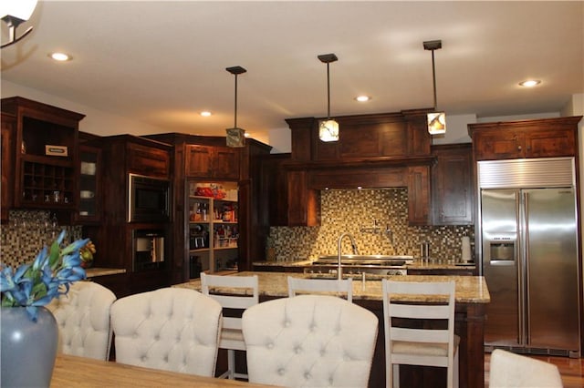 6822 Woodstock Ct, Shawnee, KS 66218 - kitchen featuring built in appliances, backsplash, decorative light fixtures, recessed lighting, and light stone counters
