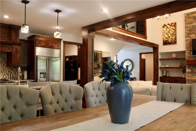 6822 Woodstock Ct, Shawnee, KS 66218 - dining area with wood finished floors, recessed lighting, and decorative columns