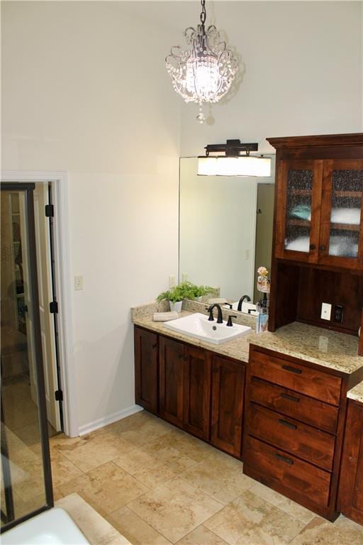 6822 Woodstock Ct, Shawnee, KS 66218 - full bath with vanity and a chandelier