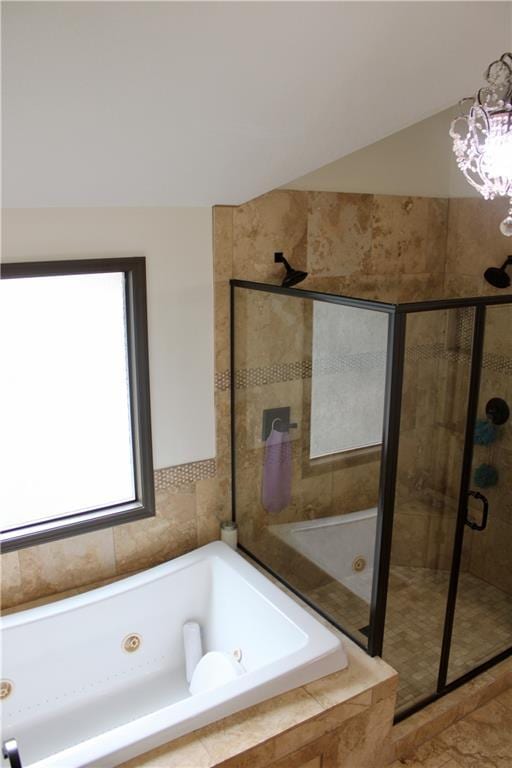6822 Woodstock Ct, Shawnee, KS 66218 - full bathroom featuring a whirlpool tub, a shower stall, and a chandelier
