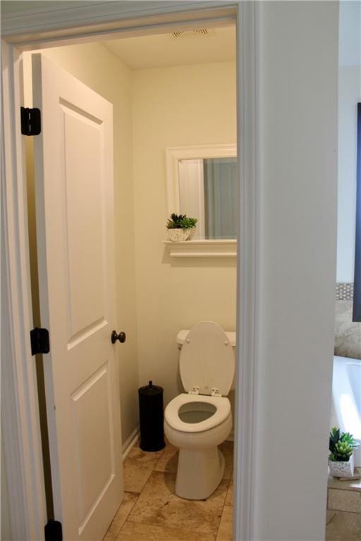 6822 Woodstock Ct, Shawnee, KS 66218 - bathroom featuring toilet