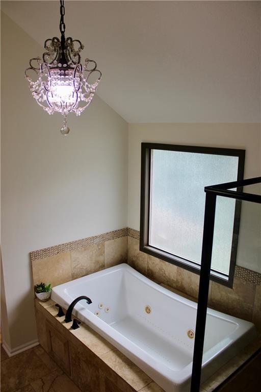 6822 Woodstock Ct, Shawnee, KS 66218 - full bathroom with a whirlpool tub and a chandelier