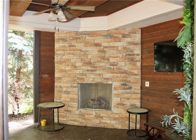 6822 Woodstock Ct, Shawnee, KS 66218 - living room featuring ceiling fan and wooden walls