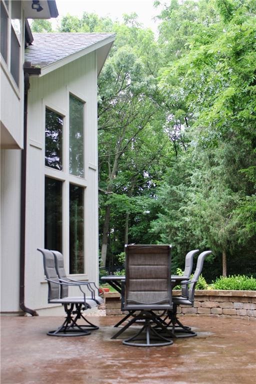 6822 Woodstock Ct, Shawnee, KS 66218 - wooden deck with a patio