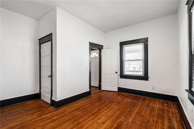 2905 Wabash Ave, Kansas City, MO 64109 - unfurnished bedroom featuring baseboards and wood finished floors