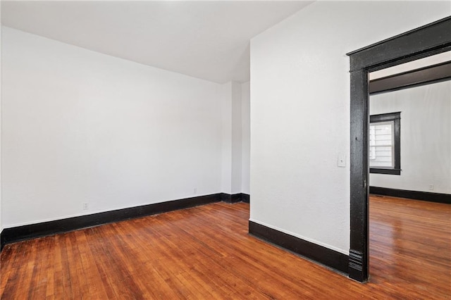 2905 Wabash Ave, Kansas City, MO 64109 - unfurnished room featuring baseboards and wood finished floors