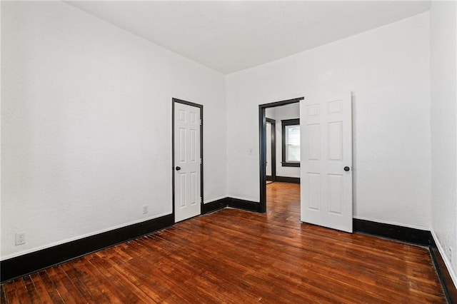 2905 Wabash Ave, Kansas City, MO 64109 - spare room featuring baseboards and wood finished floors