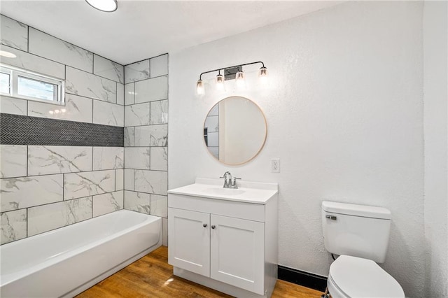 2905 Wabash Ave, Kansas City, MO 64109 - full bathroom featuring toilet, wood finished floors, vanity, and bathtub / shower combination