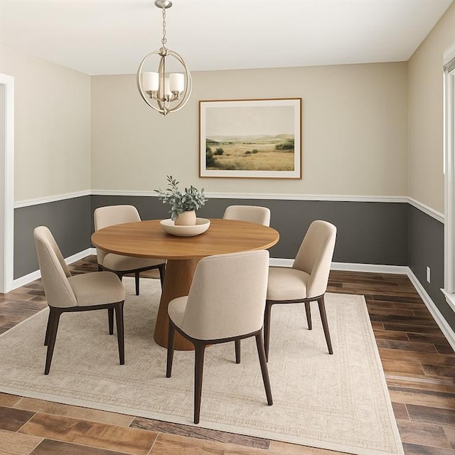 8813 W 106th Cir, Overland Park, KS 66212 - dining space with a chandelier, dark wood-type flooring, and baseboards