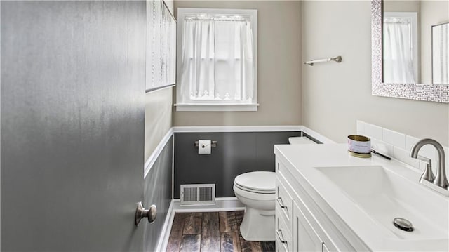 8813 W 106th Cir, Overland Park, KS 66212 - bathroom featuring toilet, vanity, and wood finished floors