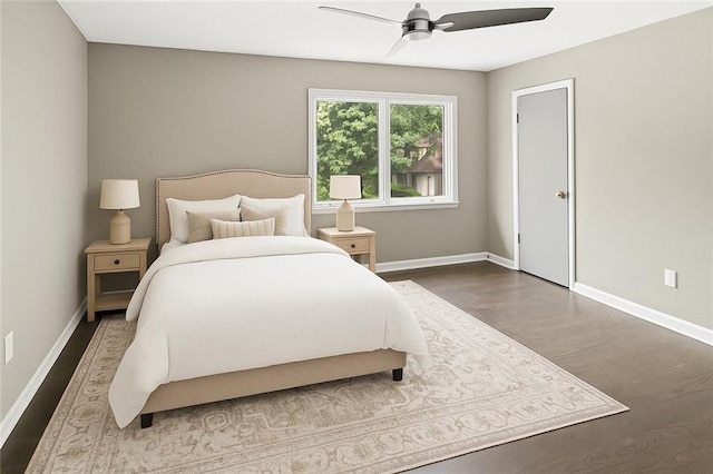 8813 W 106th Cir, Overland Park, KS 66212 - bedroom with wood finished floors, baseboards, and ceiling fan