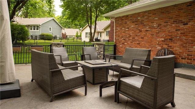 8813 W 106th Cir, Overland Park, KS 66212 - view of patio / terrace with a residential view and an outdoor living space with a fire pit