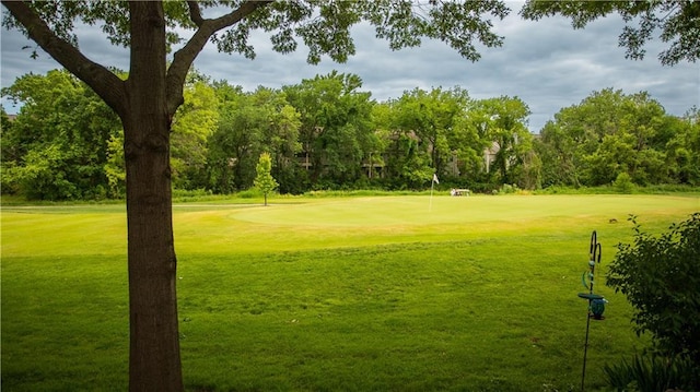 8813 W 106th Cir, Overland Park, KS 66212 - surrounding community featuring golf course view, a lawn, and an area to practice putting