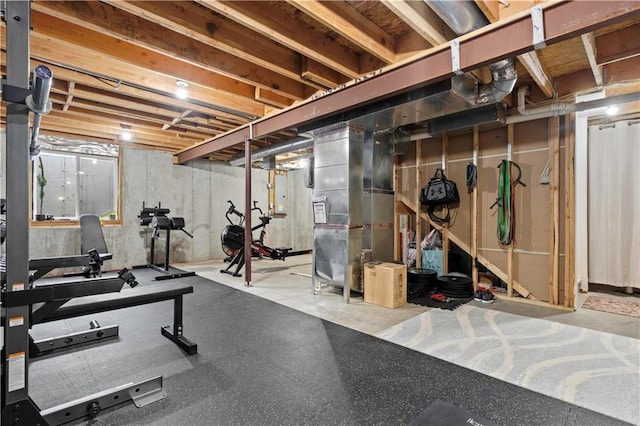 workout room featuring heating unit