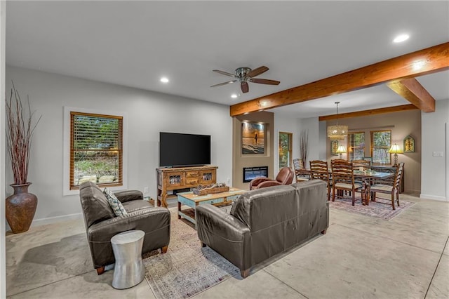 4866 Dabinawa Dr, Mclouth, KS 66054 - living area with baseboards, ceiling fan with notable chandelier, beam ceiling, and recessed lighting