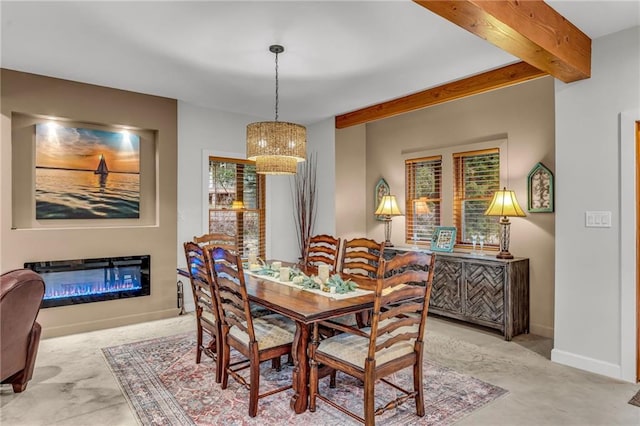 4866 Dabinawa Dr, Mclouth, KS 66054 - dining room with baseboards, a glass covered fireplace, a notable chandelier, and beam ceiling