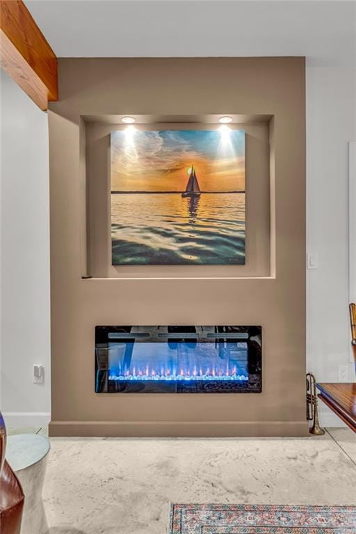 4866 Dabinawa Dr, Mclouth, KS 66054 - interior details with baseboards and a glass covered fireplace