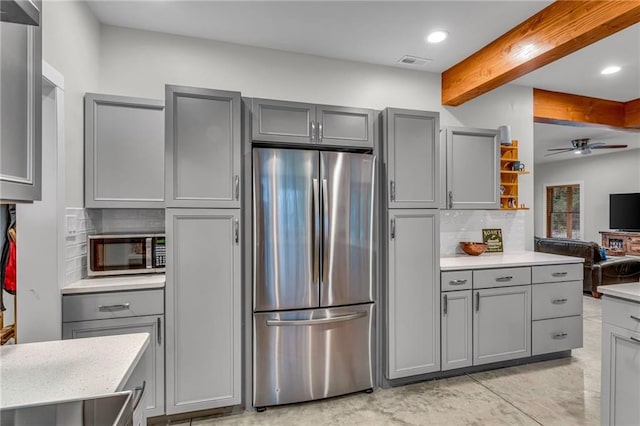 4866 Dabinawa Dr, Mclouth, KS 66054 - kitchen with gray cabinets, visible vents, light countertops, and appliances with stainless steel finishes