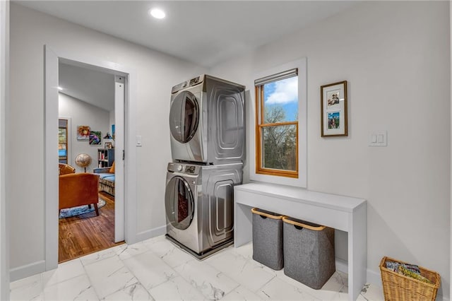 4866 Dabinawa Dr, Mclouth, KS 66054 - clothes washing area with baseboards, marble finish floor, laundry area, recessed lighting, and stacked washing maching and dryer