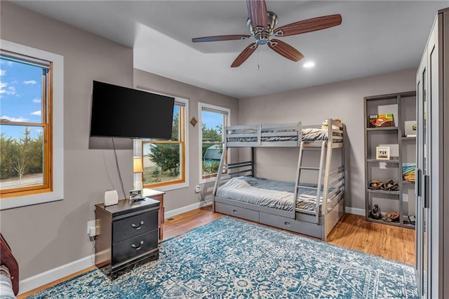4866 Dabinawa Dr, Mclouth, KS 66054 - bedroom with baseboards, wood finished floors, recessed lighting, and a ceiling fan