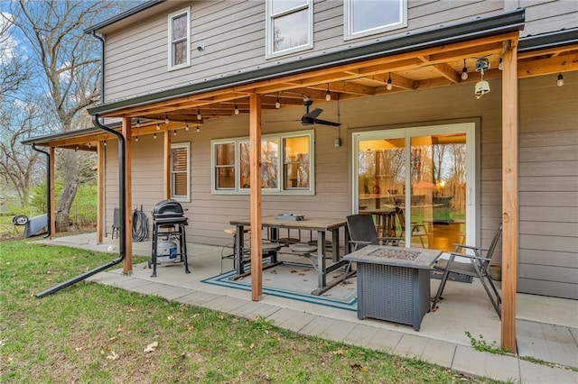 4866 Dabinawa Dr, Mclouth, KS 66054 - exterior space featuring a patio, an outdoor fire pit, and a ceiling fan