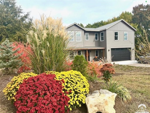 4866 Dabinawa Dr, Mclouth, KS 66054 - view of front of property with driveway and an attached garage